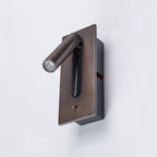 Close angle on this Clérachic reading light in bronze, head turned to the side, mounted on a plain wall.