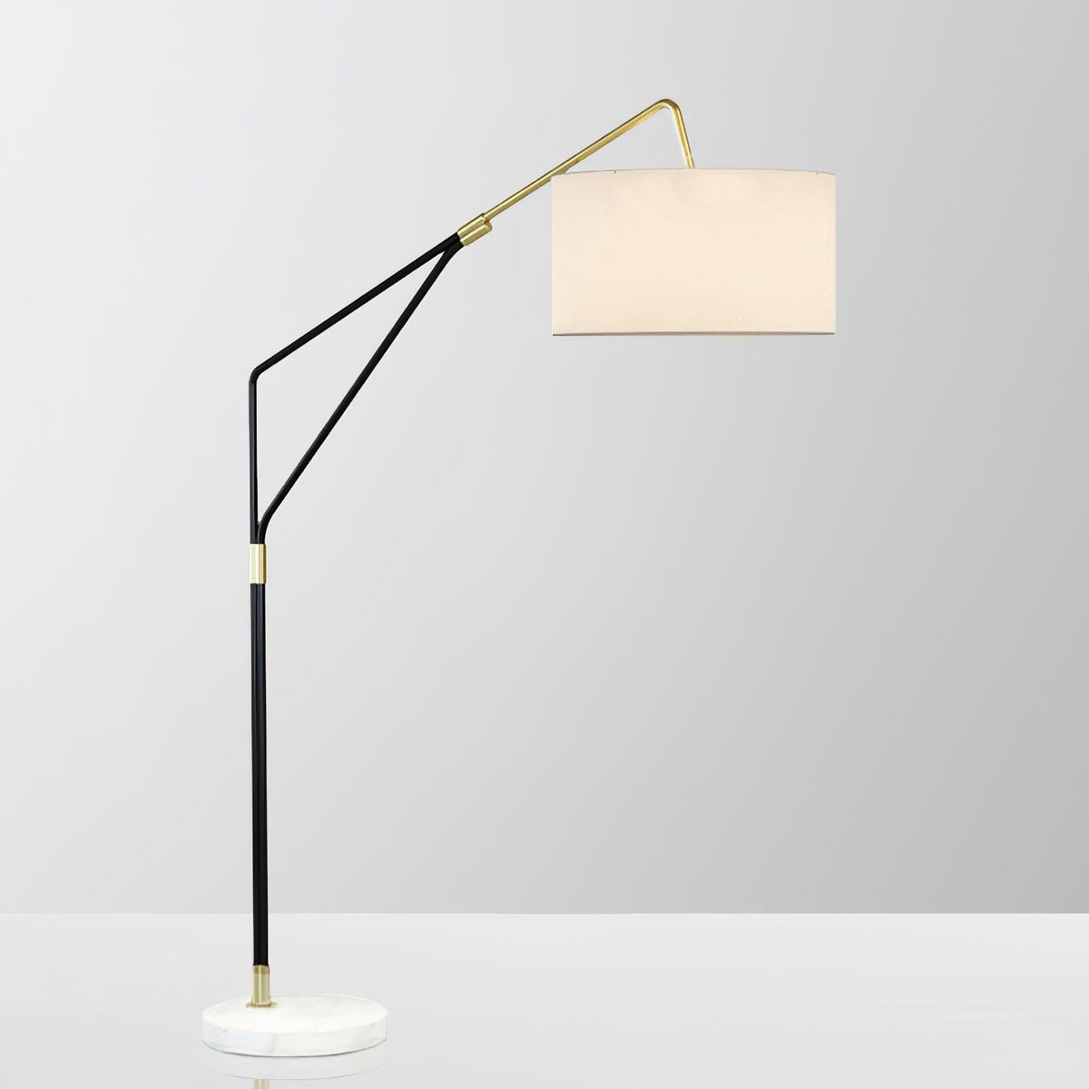 Clérachic black arc floor lamp shown close-in on a plain white background, its linen shade angled toward the camera.