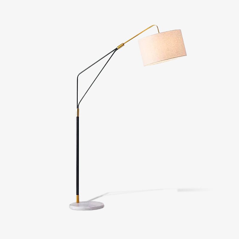 Clérachic black arc floor lamp on a plain white background, cast with a soft drop shadow beneath its marble base.