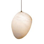 The tapered teardrop shade seen from the side, showing its off-centre stone silhouette