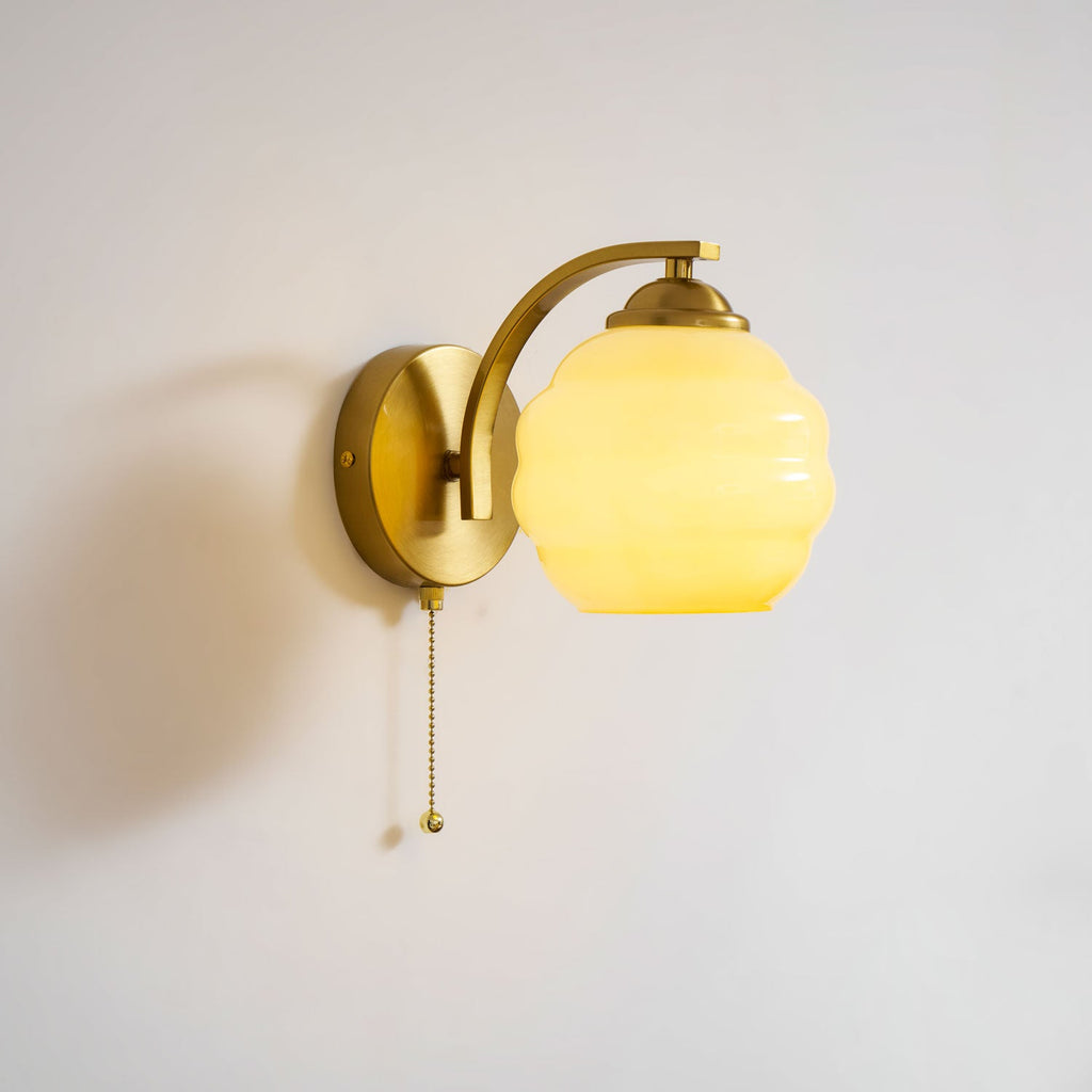 Gatsby wall lamp casting warm light across a hallway