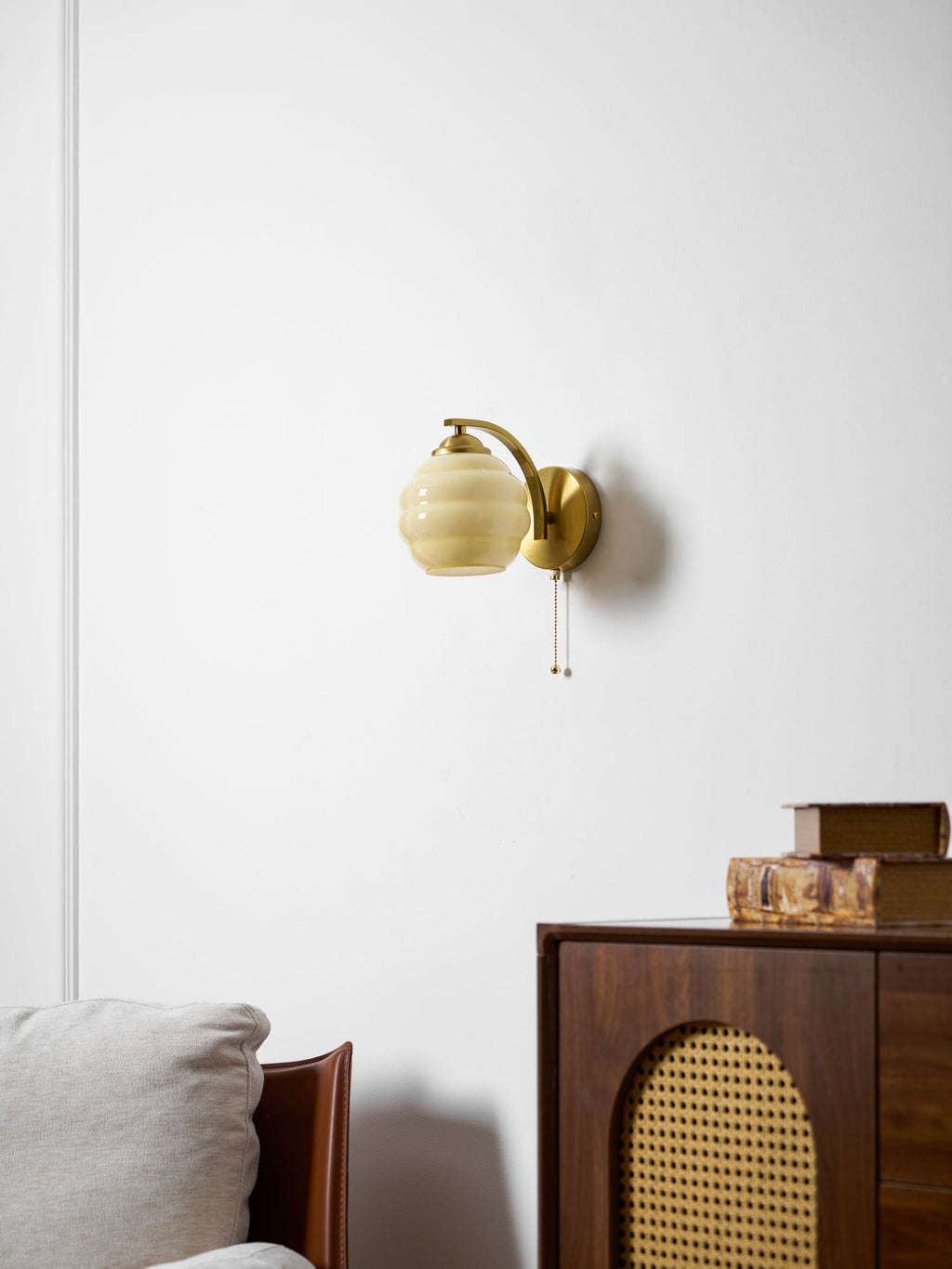 Gatsby wall lamp with curved glass shade and chrome accents