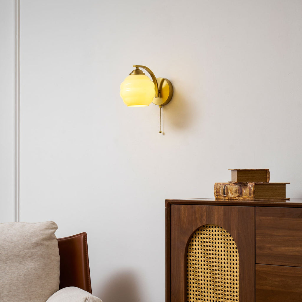 Gatsby wall lamp with glass shade and gold toned finish