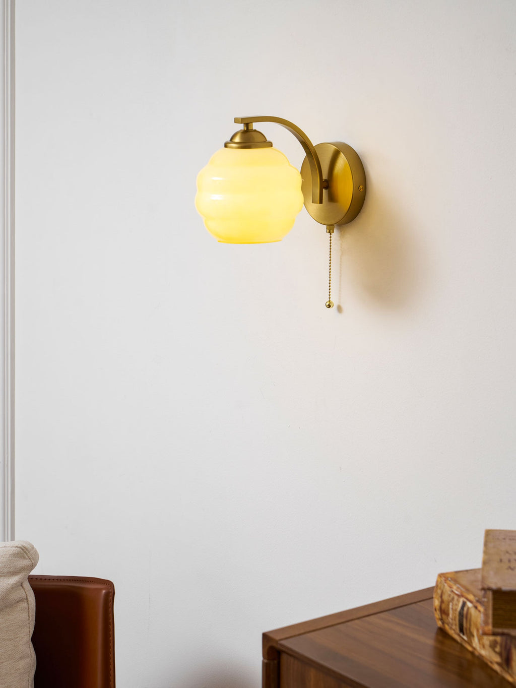 Gatsby wall lamp showing curved glass shade and metal body