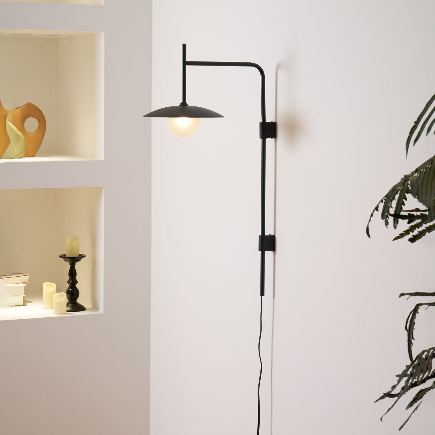 Swing arm wall lamp casting soft light in a quiet corner