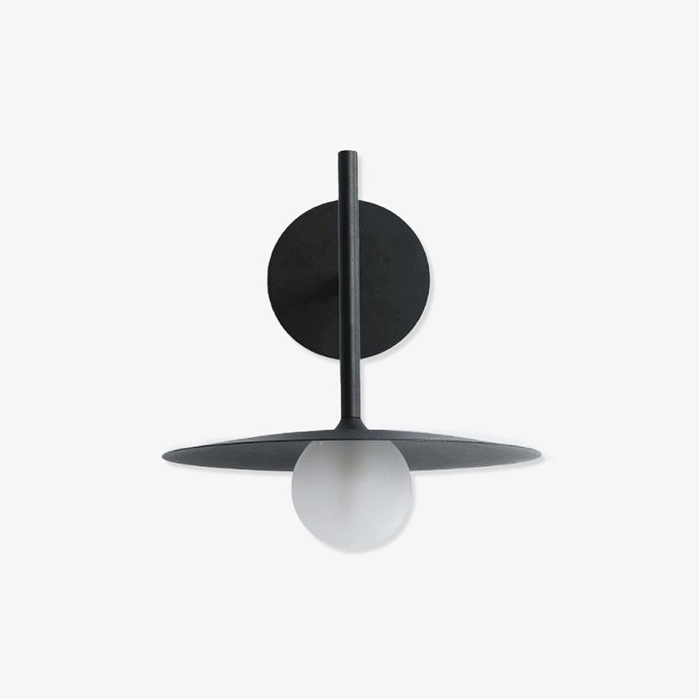 Angled studio view of this black Clérachic wall light, shown unlit against a plain backdrop.