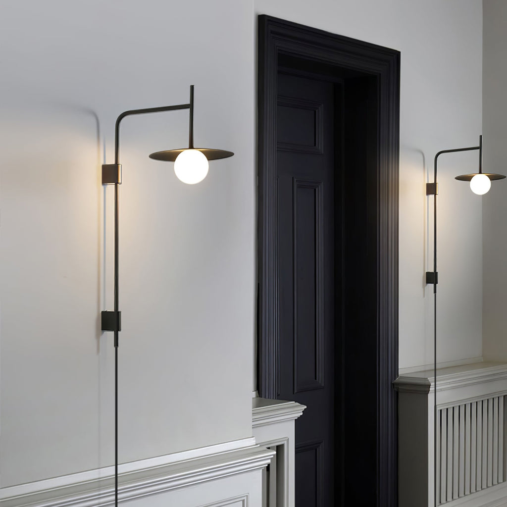 Swing arm wall lamp with adjustable arm and glass shade
