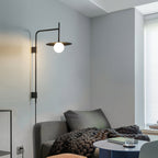 Adjustable swing arm wall lamp lighting a reading corner