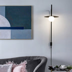 Black swing arm wall lamp with frosted glass shade glowing
