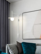 Swing arm wall lamp with adjustable arm and glass shade lit