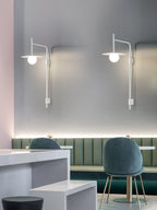 Swing arm wall lamp with frosted glass shade and iron detail