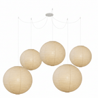 Mulberry paper pendant light lit warmly overhead