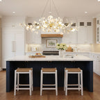 Linear porcelain ginkgo chandelier above a long wood table