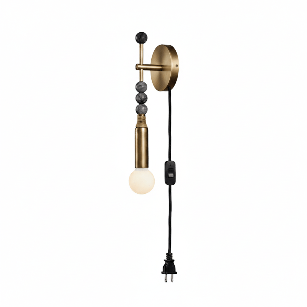 Clérachic wall light on white, rounder dark beads stacked above a lit glass globe, cord and plug hanging below.