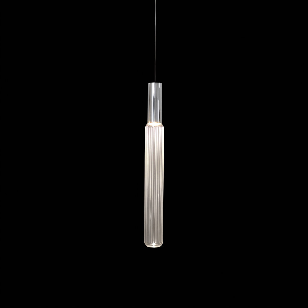A slim chrome rod suspends this Clérachic pendant's fluted glass cylinder, lit against black.