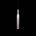 A slim chrome rod suspends this Clérachic pendant's fluted glass cylinder, lit against black.