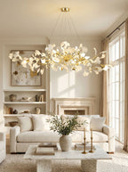 Brass branch chandelier with layered white porcelain leaves