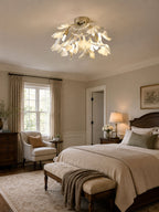 White ceramic ginkgo leaf ceiling lamp on neutral background
