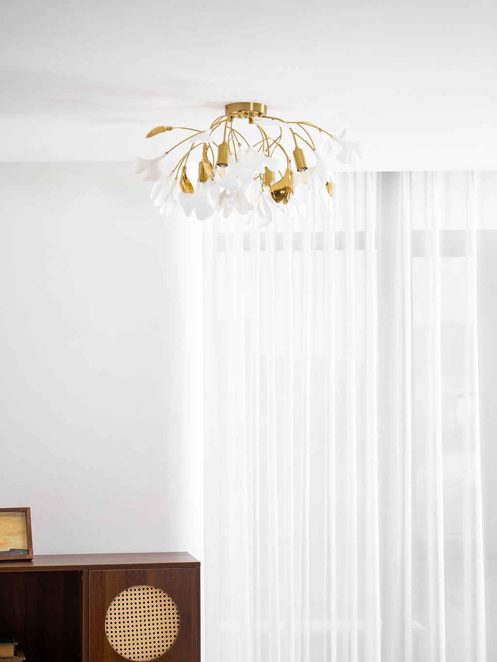 Glowing ginkgo leaf ceiling light with layered ceramic leaves