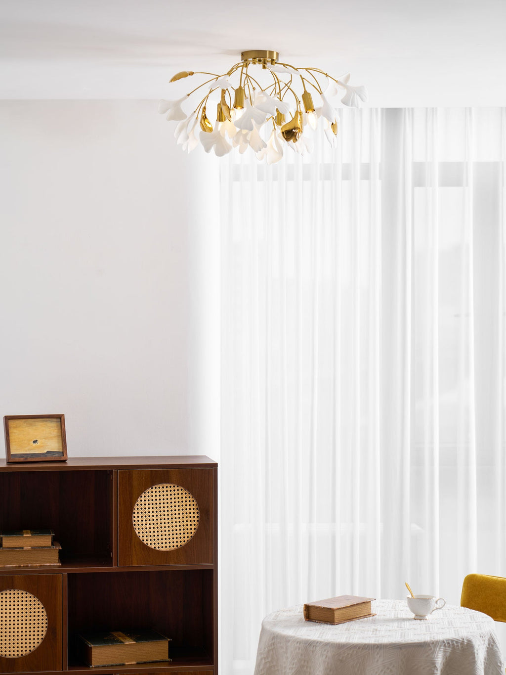 Ginkgo leaf ceiling lamp glowing softly in a dim room