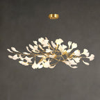 Detail of porcelain ginkgo leaves along a brass branch