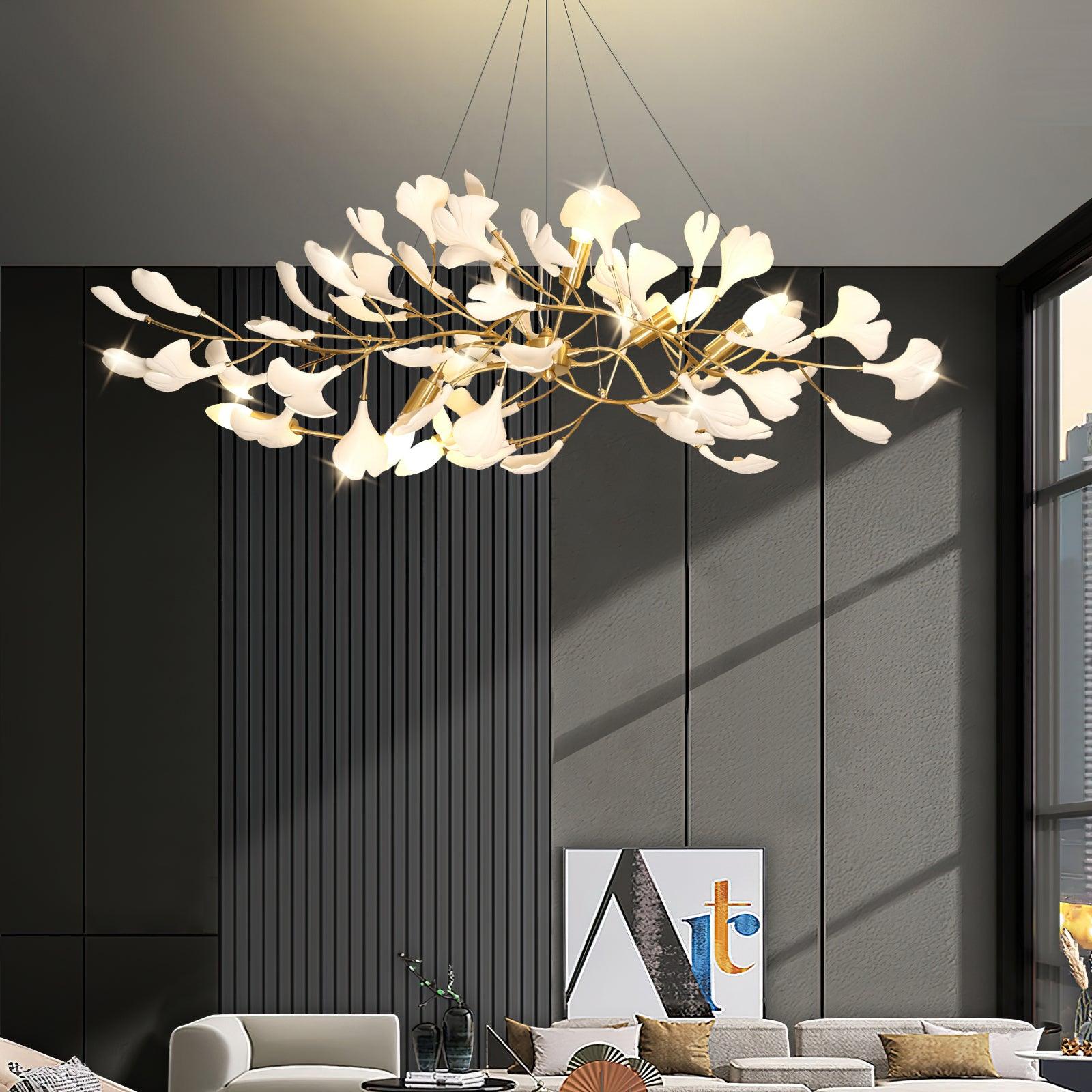 Linear ginkgo chandelier with brass branches and porcelain leaves