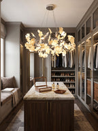 Brass ring chandelier with porcelain ginkgo leaves, side view