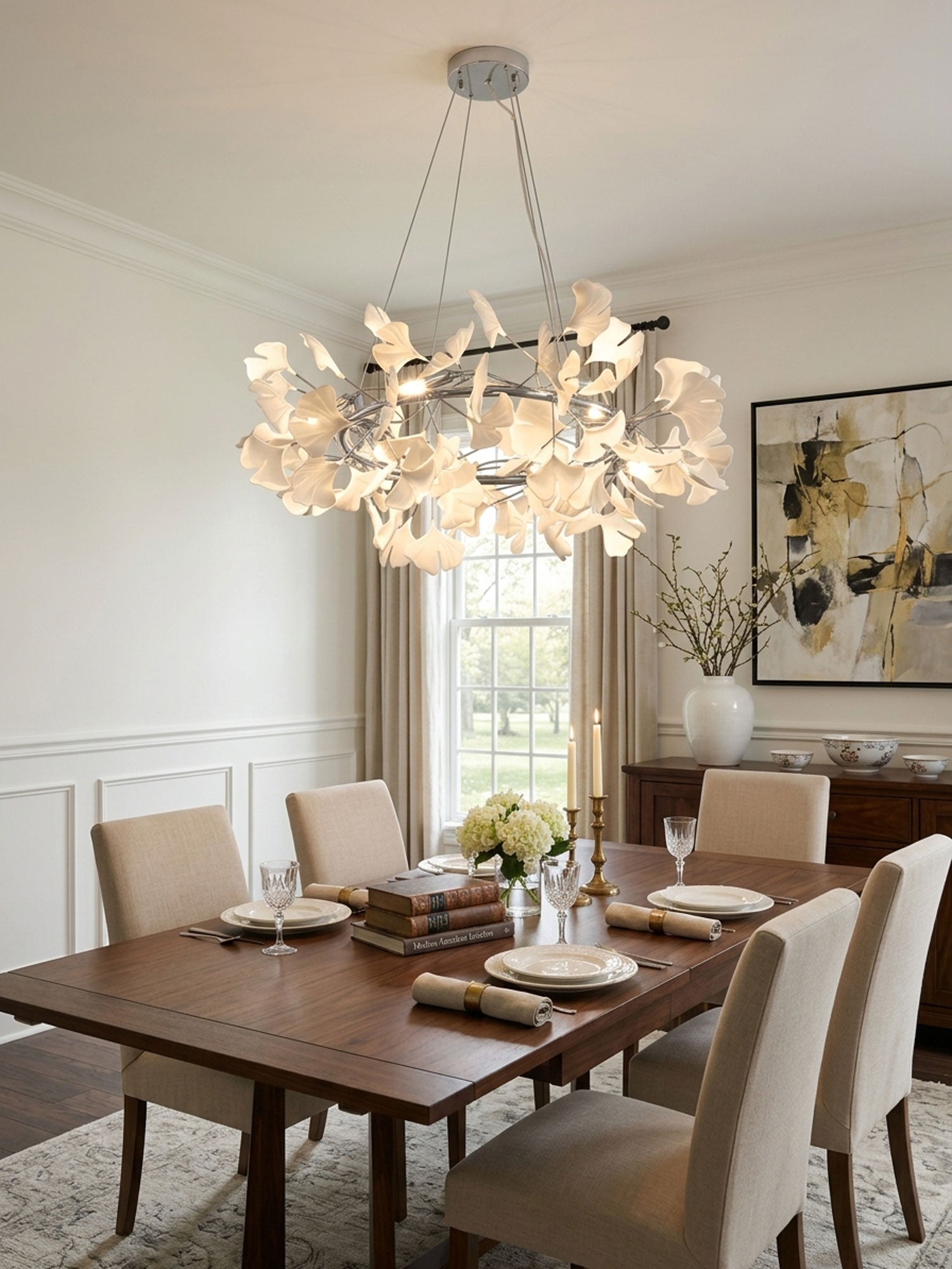 Crown chandelier with white porcelain ginkgo leaves lit warm