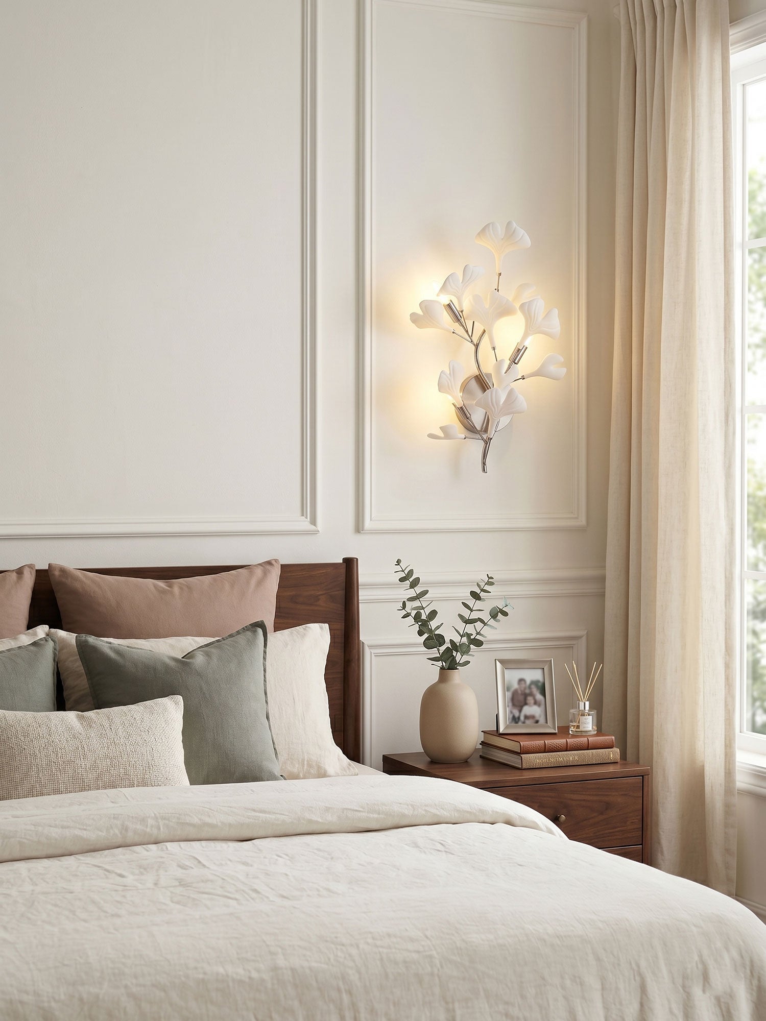 White ceramic ginkgo leaf wall lamp on a clean backdrop