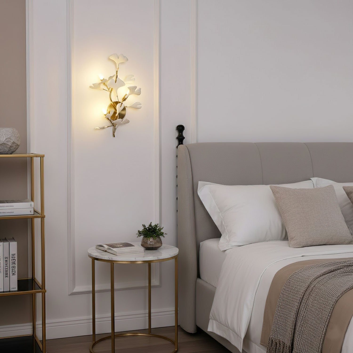 Ceramic ginkgo leaf wall lamp lit in a calm interior