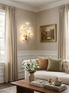Porcelain ginkgo leaf wall lamp shown against neutral wall