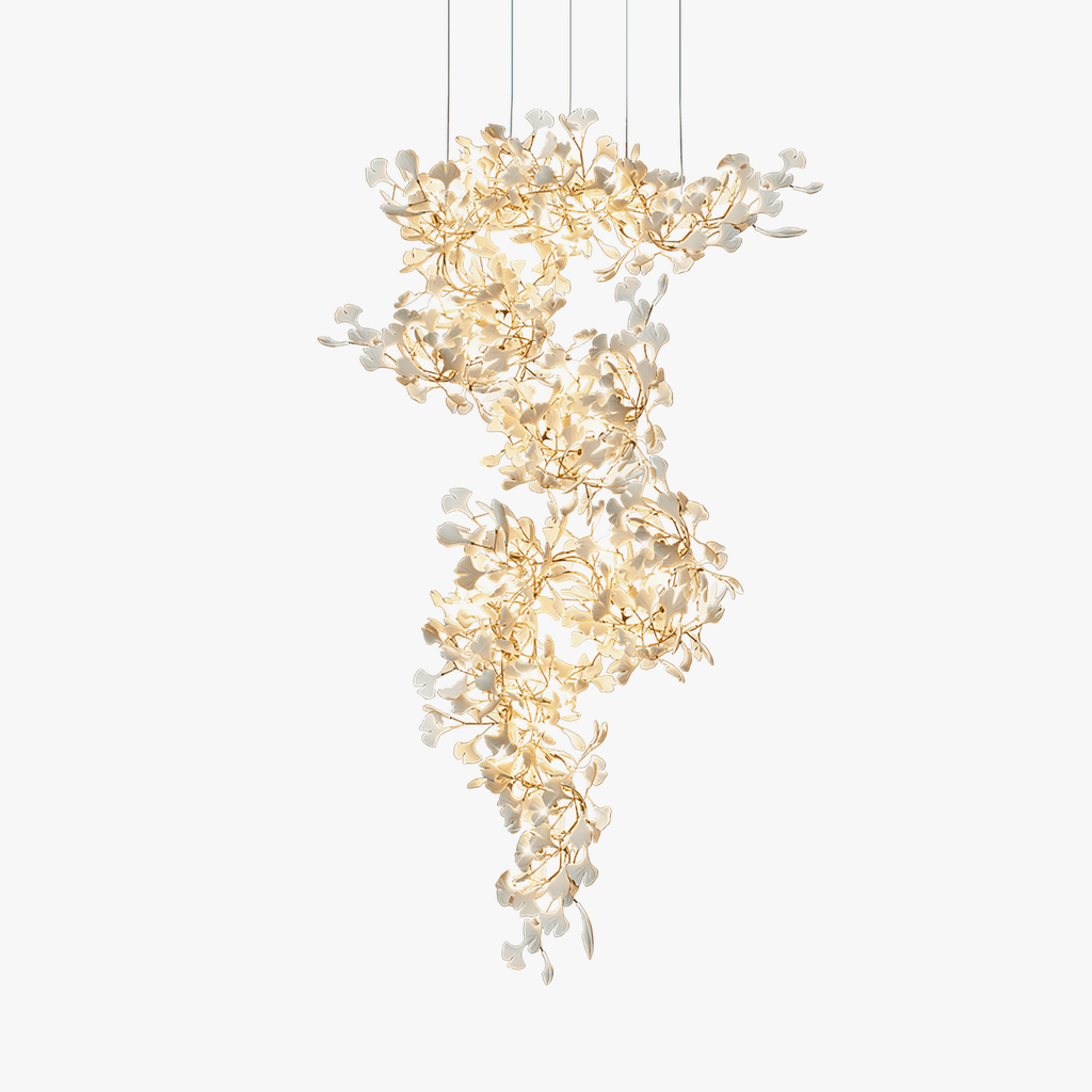 The same spiral shown on pale grey, its porcelain leaves reading cooler and more sharply defined.