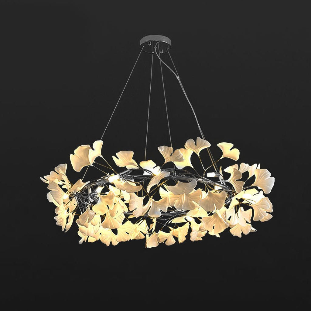 Porcelain ginkgo chandelier seen against a soft neutral wall
