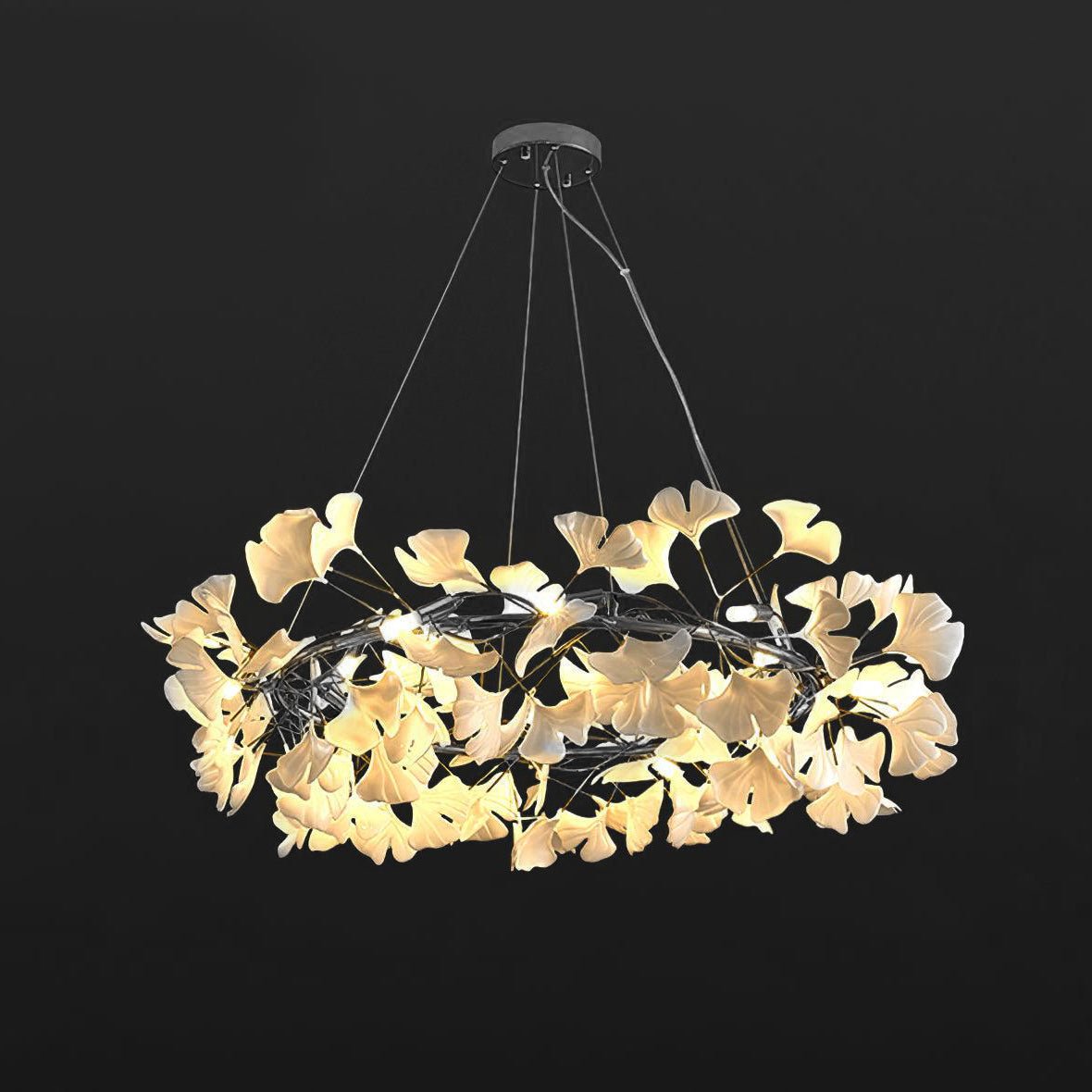 Porcelain ginkgo chandelier seen against a soft neutral wall