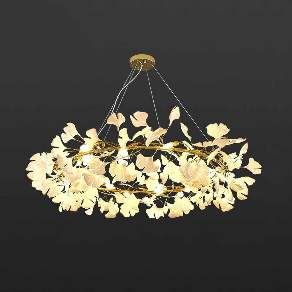 Brass crown chandelier with porcelain ginkgo leaves from below