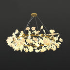 Brass crown chandelier with porcelain ginkgo leaves from below