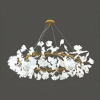 Brass ring chandelier with layered porcelain leaves from below