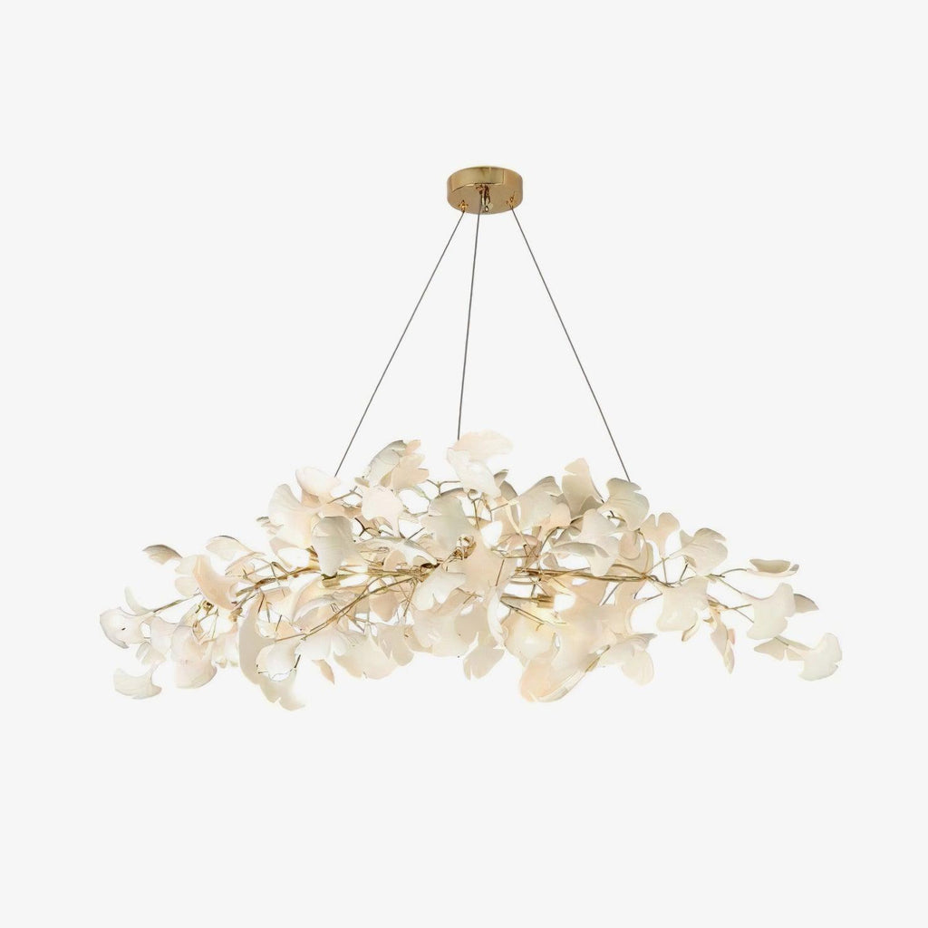 Detail of porcelain leaves and warm bulbs on the chandelier