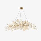 Detail of porcelain leaves and warm bulbs on the chandelier