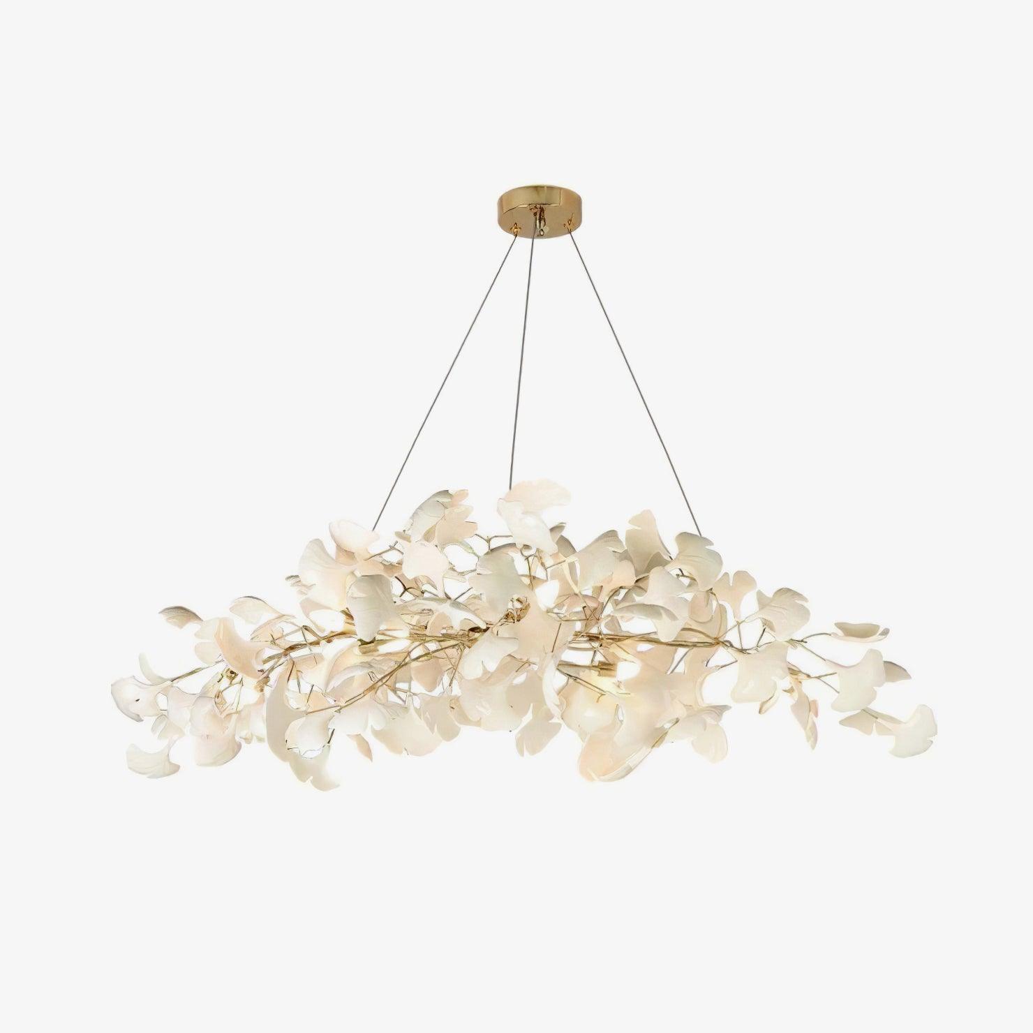 Detail of porcelain leaves and warm bulbs on the chandelier