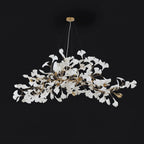 Porcelain leaf chandelier suspended over a set table