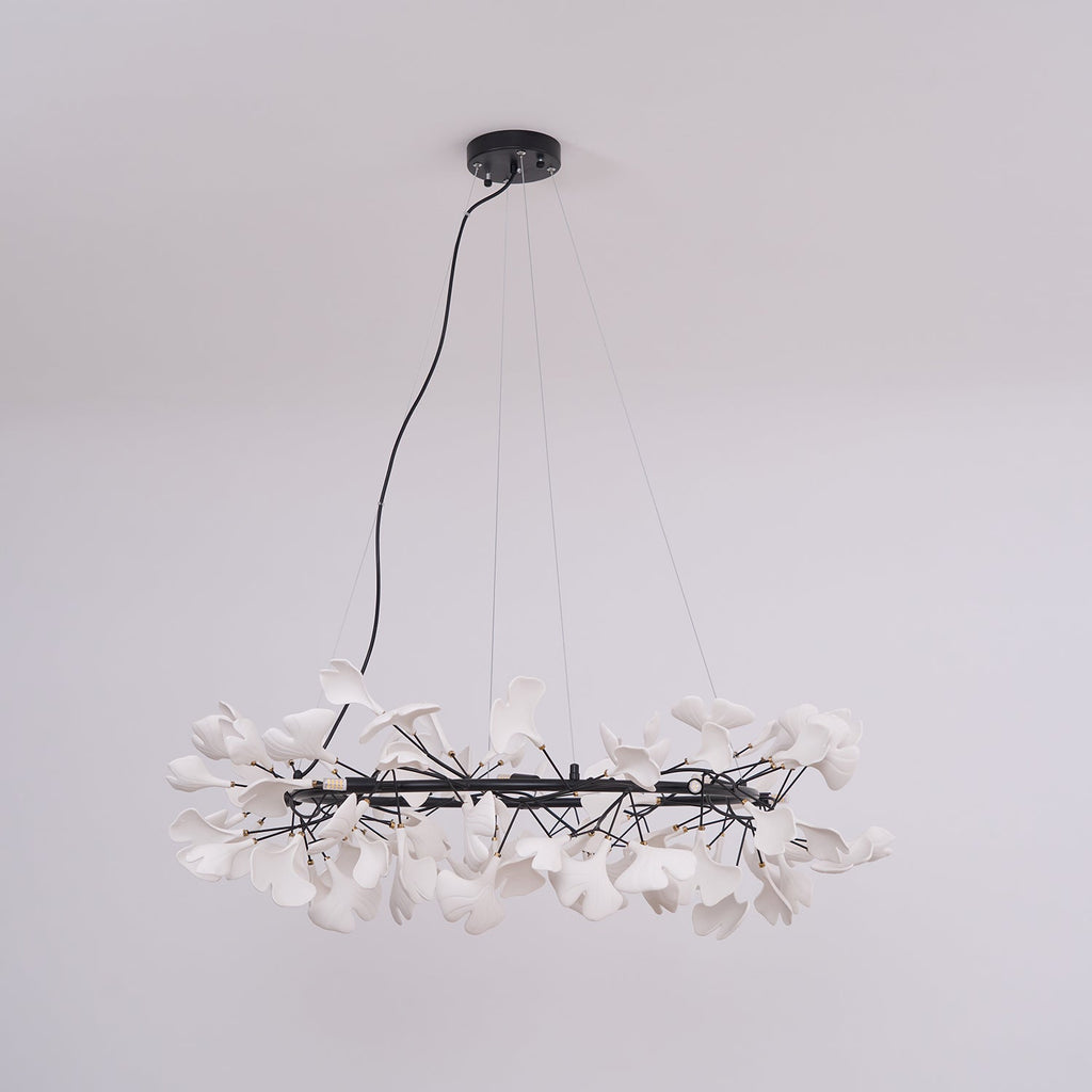 Round ginkgo chandelier with porcelain leaves and brass ring