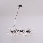 Round ginkgo chandelier with porcelain leaves and brass ring