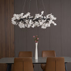 Round porcelain ginkgo chandelier glowing in a dining room
