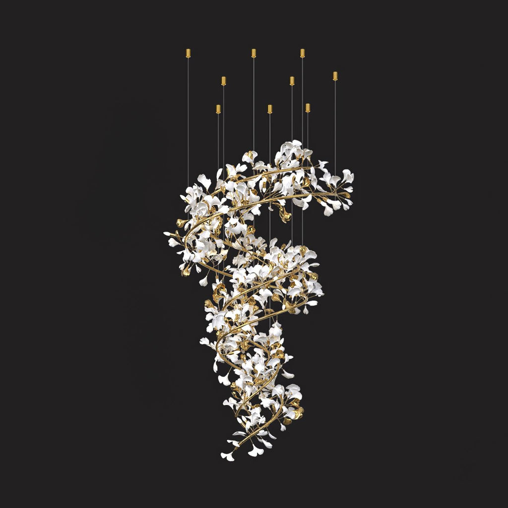 Full drop of the ceramic gingko chandelier against black, white leaves spiralling down gold branches from six ceiling points.