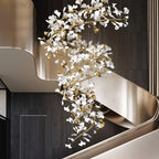The gingko column hung against dark panelling, its leaves reflected in a curved brushed-gold balustrade.