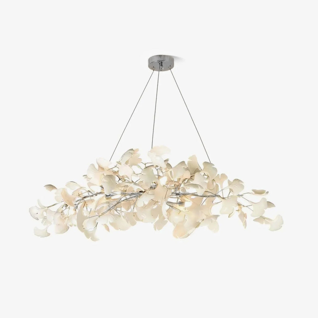 Ginkgo leaf chandelier with nickel branches above a table