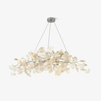 Ginkgo leaf chandelier with nickel branches above a table