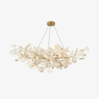 Porcelain gingko chandelier glowing softly in a sophisticated space