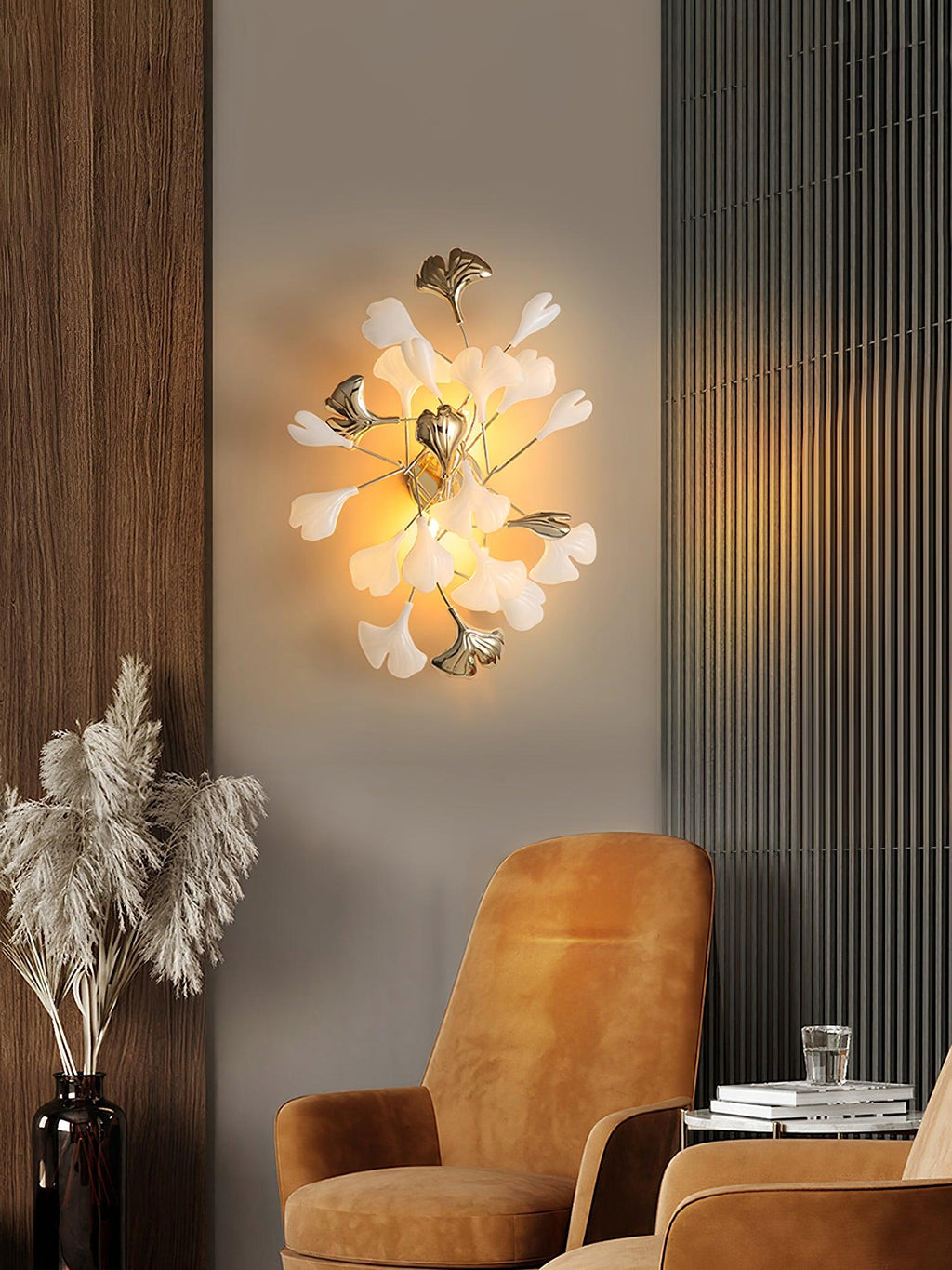 Ceramic ginkgo leaf wall lamp casting a soft glow